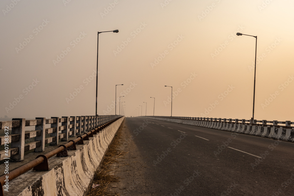 road bridge over river at dawn from flat angle