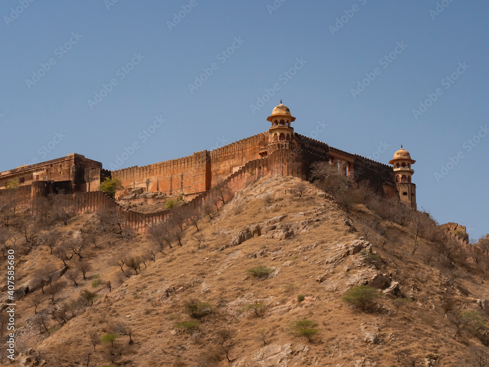 tower and fort on a hill near amer fort in jaipur