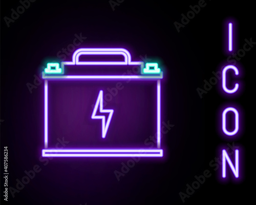 Glowing neon line Car battery icon isolated on black background. Accumulator battery energy power and electricity. Lightning bolt. Colorful outline concept. Vector.