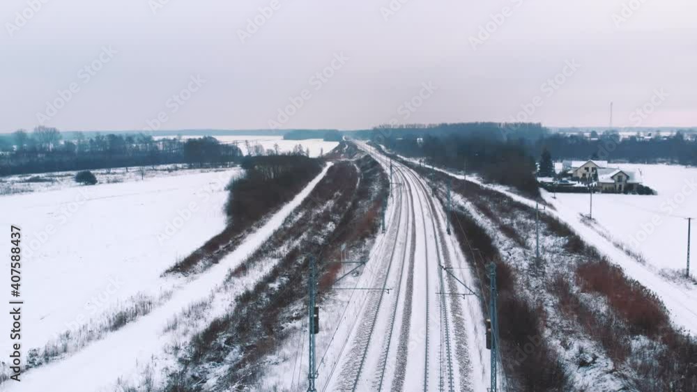 Aerial view of empty railway covered in snow. High quality 4k footage Aerial view of empty railway covered in snow. High quality 4k footage