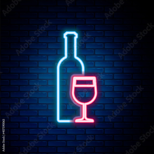 Glowing neon line Wine bottle with wine glass icon isolated on brick wall background. Colorful outline concept. Vector.