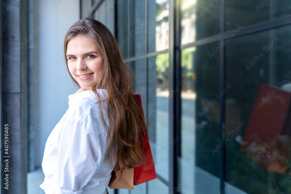 Shopping and fun concept. Beautiful woman walking with shopping bags in the city. Shopping and fun concept. Beautiful woman walking with shopping bags in the city.