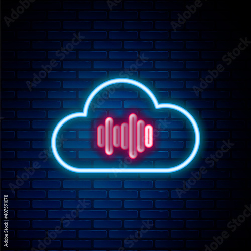 Glowing neon line Music streaming service icon isolated on brick wall background. Sound cloud computing, online media streaming, online song, audio wave. Colorful outline concept. Vector.