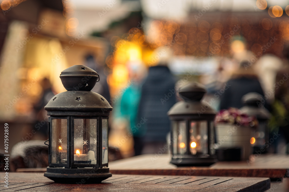 two candle lanterns on outdoor coffee tables
