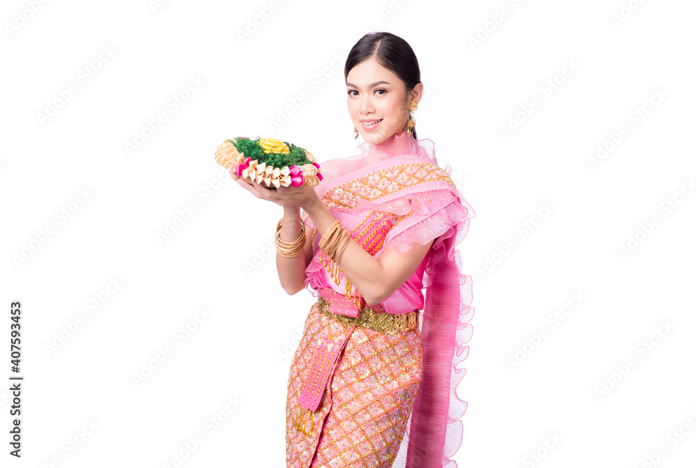 Portrait of Beautiful Thai girl in traditional costume With a lotus flower in his hand on white background Portrait of Beautiful Thai girl in traditional costume With a lotus flower in his hand on white background
