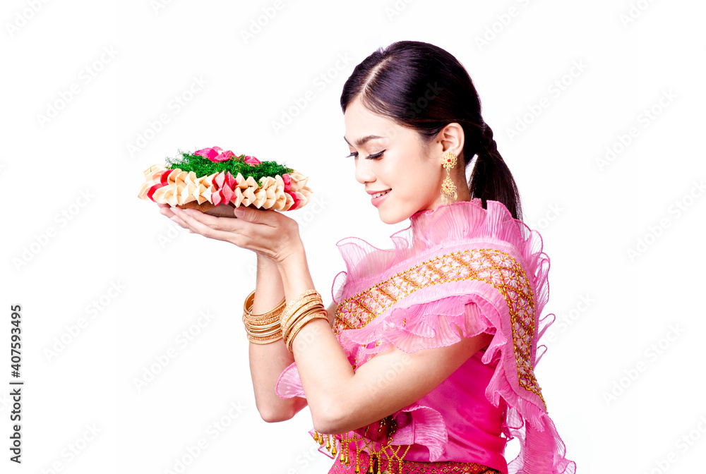 Portrait of Beautiful Thai girl in traditional costume With a lotus flower in his hand on white background Portrait of Beautiful Thai girl in traditional costume With a lotus flower in his hand on white background