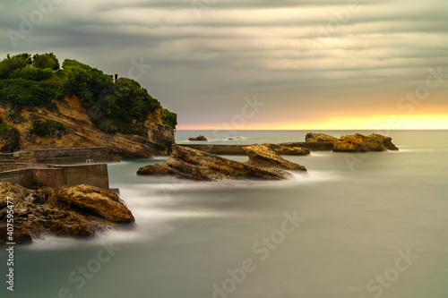 Seascape in Biarritz France in long photographic exposure. Dramatic sky. 