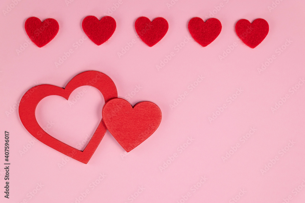 Valentine's day background. Red hearts on pastel pink colors. Valentine's day concept. Flat lay. Valentine's day background. Red hearts on pastel pink colors. Valentine's day concept. Flat lay.