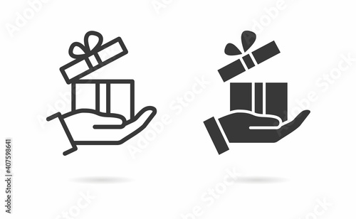 Gift in hand icon. Vector illustration.