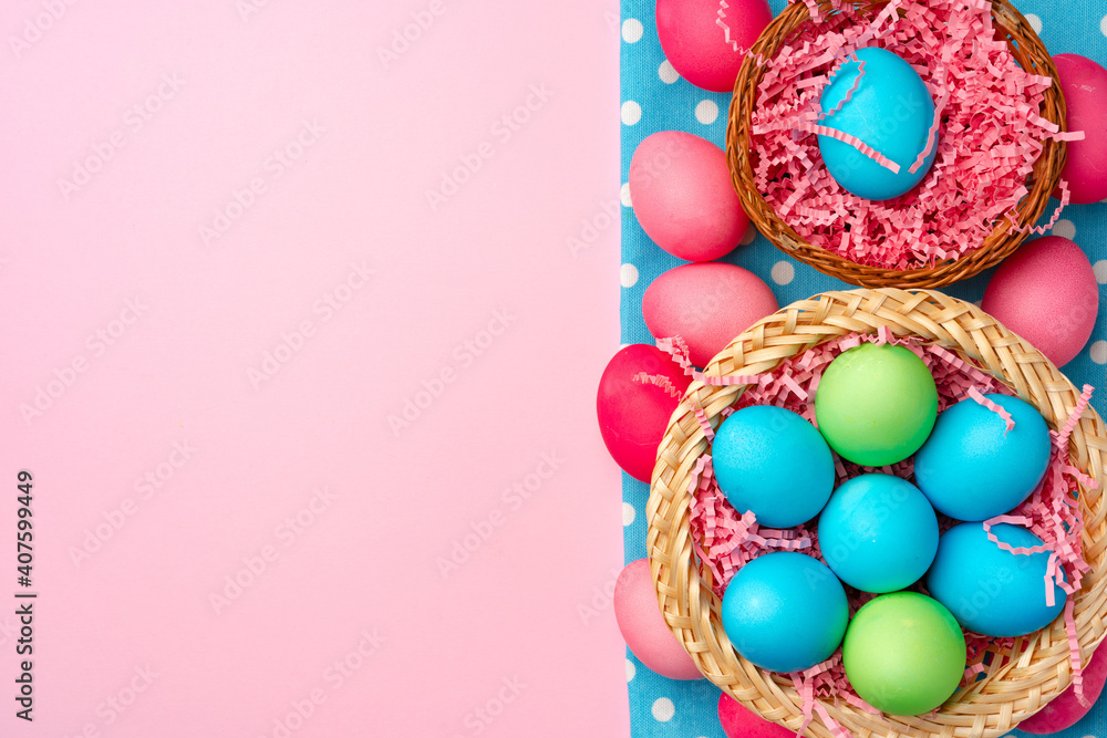 Painted Easter eggs in decorative nest on pink background Painted Easter eggs in decorative nest on pink background