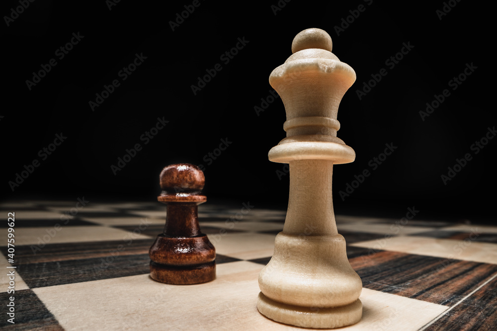 Chess game with chess pieces against black background Chess game with chess pieces against black background