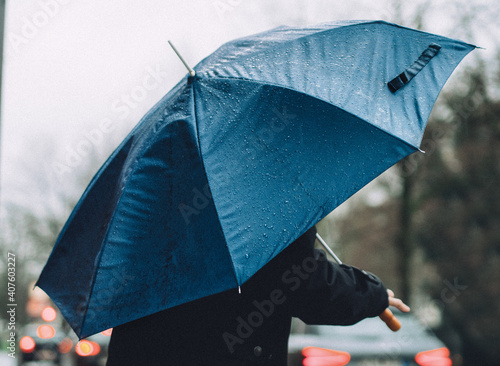 close up of man holding umbrella