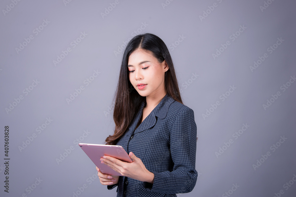 Office time, Asian young woman working in office With stress and business communication through mobile phones, executives, business women Office time, Asian young woman working in office With stress and business communication through mobile phones, executives, business women