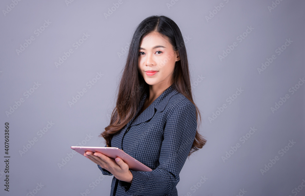 Office time, Asian young woman working in office With stress and business communication through mobile phones, executives, business women Office time, Asian young woman working in office With stress and business communication through mobile phones, executives, business women
