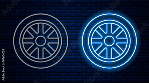 Glowing neon line Car wheel icon isolated on brick wall background. Vector.
