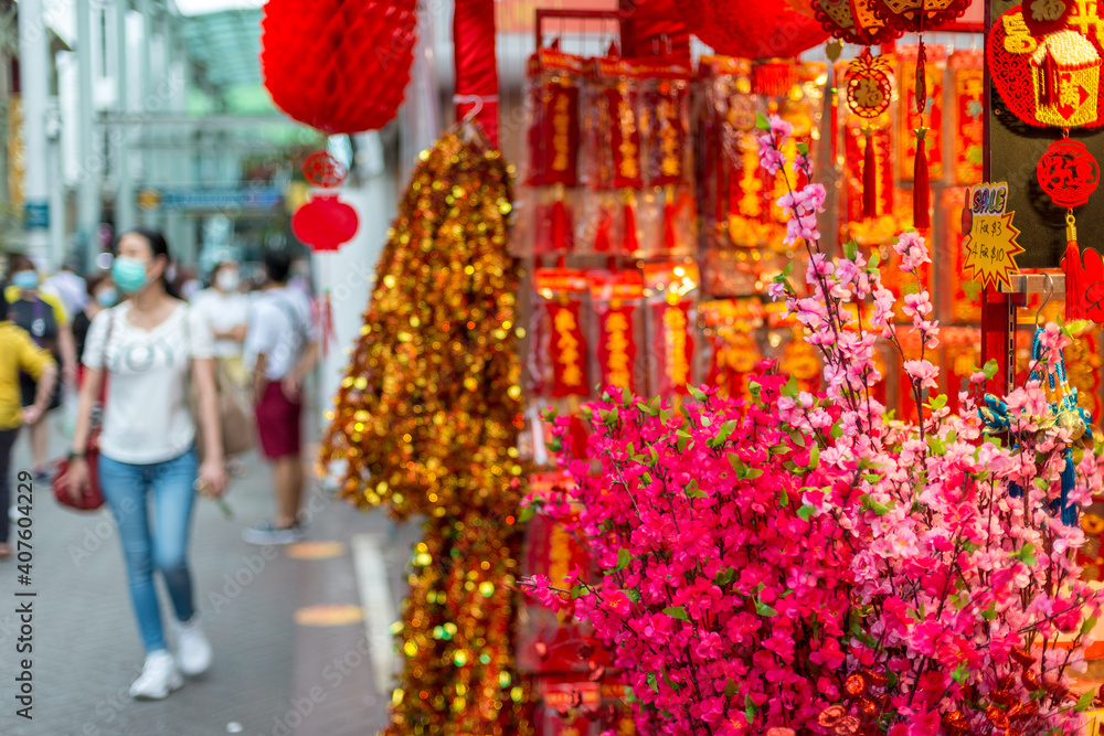 Naklejka premium Outdoor Asia Spring Lunar Chinese New Year ornaments decorations. Red is seen as lucky and auspicious by many who believes in traditional customs. Translation: