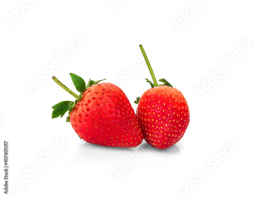 Two red strawberry fruits with green leaves isolated on white background. Clipping path.