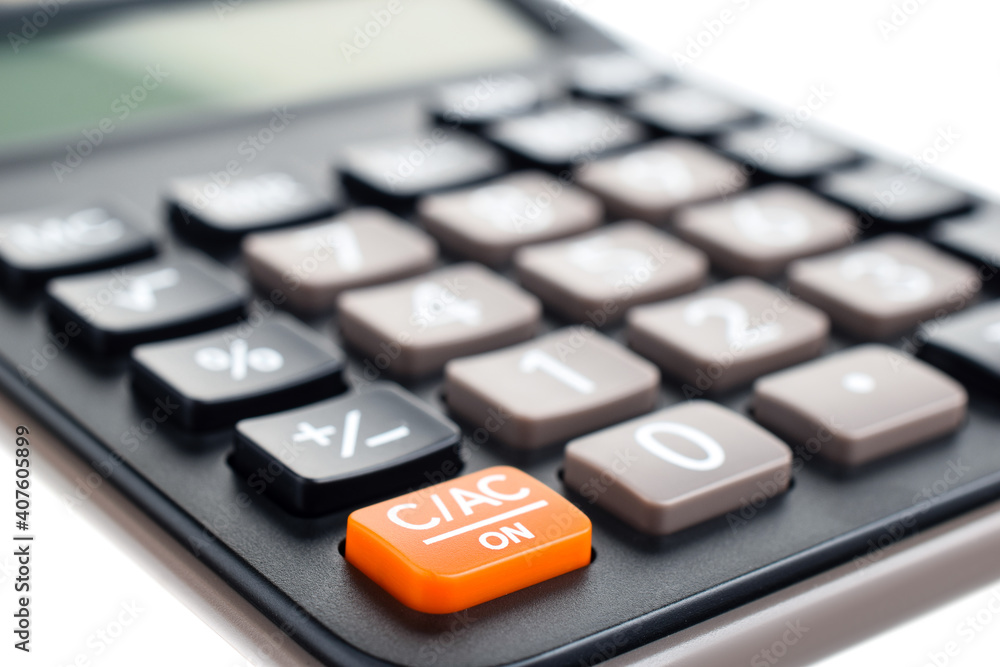 Black plastic digital calculator, isolated on a white background, close-up. Symbol economics, mathematics, accounting, finance concept. The day of knowledge, to calculate, to count money Black plastic digital calculator, isolated on a white background, close-up. Symbol economics, mathematics, accounting, finance concept. The day of knowledge, to calculate, to count money