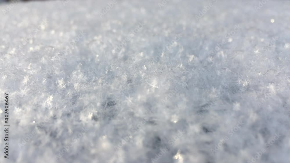 lots of fresh and white snow. Snowflakes sparkle and shine in the sun. Beautiful winter background and atmosphere lots of fresh and white snow. Snowflakes sparkle and shine in the sun. Beautiful winter background and atmosphere