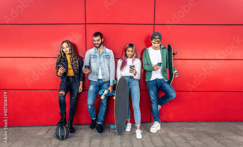 Young people using smart phone device outdoor - Teenagers addiction to new technology trends -  Concept about tech  youth  social and people.