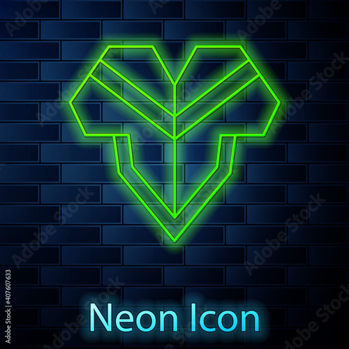 Glowing neon line Traditional mexican poncho clothing icon isolated on brick wall background. Vector.
