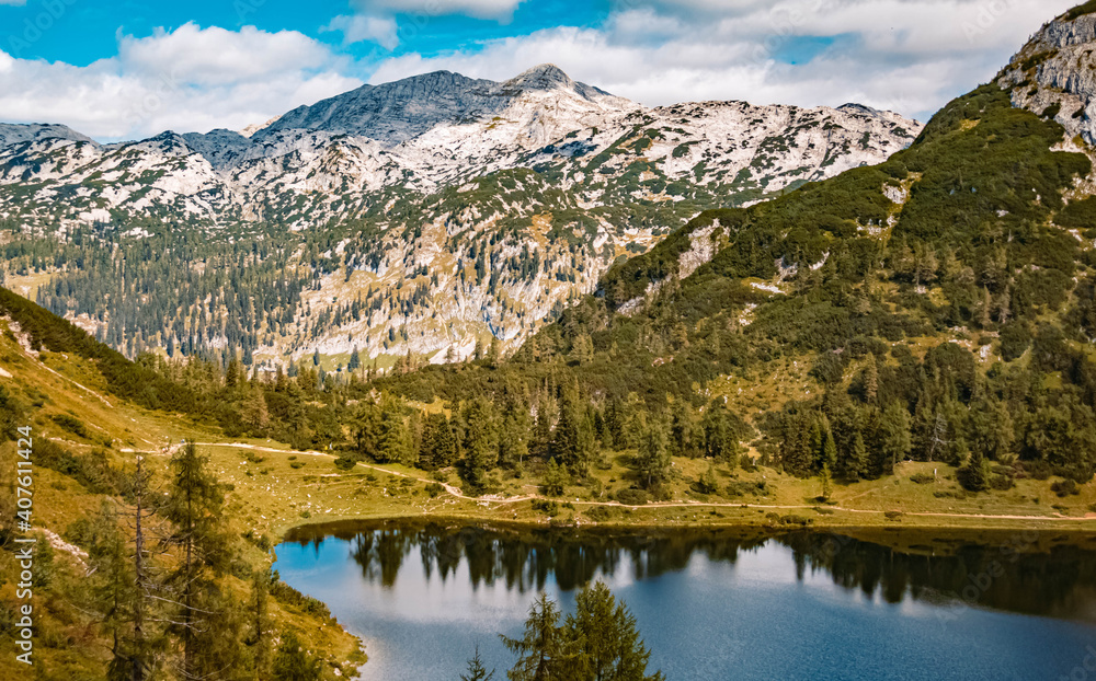 Fototapeta premium Beautiful alpine summer view with reflections in a lake at the famous Tauplitzalm, Salzkammergut, Steiermark, Austria