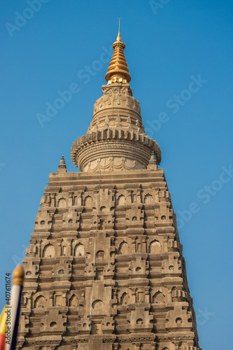 The stupa at Mahabodhi Temple Complex by blue sky in Bodh Gaya  India.