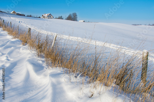 Fototapeta Naklejka Na Ścianę i Meble -  Snow on the meadow, beautiful winter landscape, Masuria in Poland