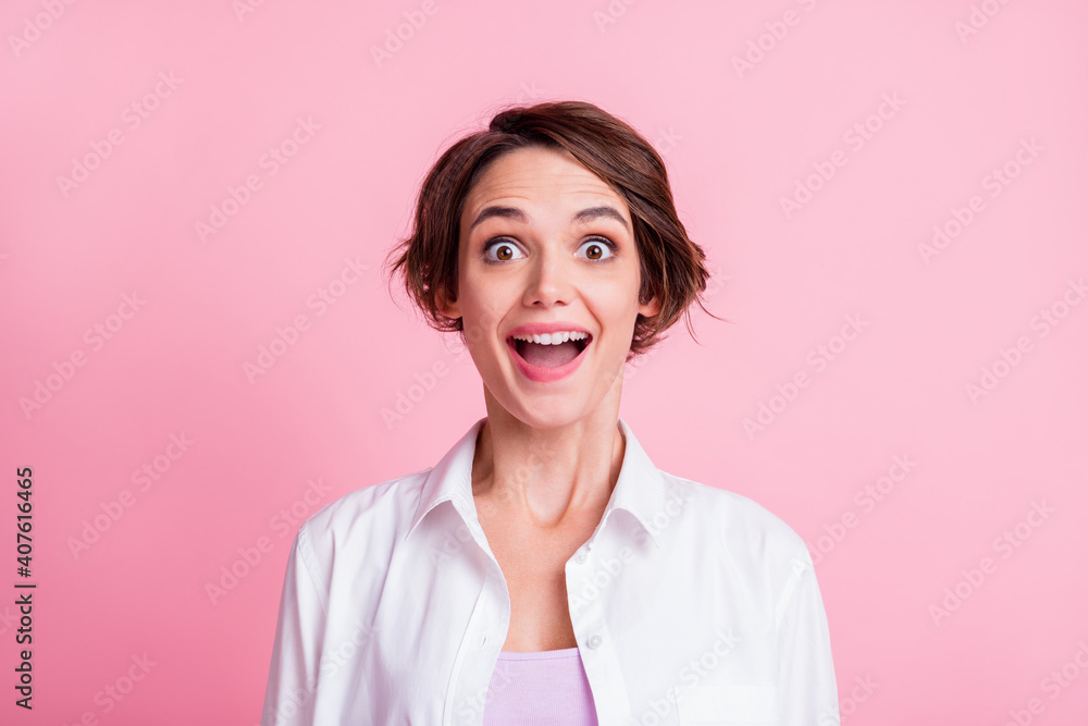 Photo portrait of happy amazed young woman wearing stylish white shirt opened mouth isolated on pink pastel color background Photo portrait of happy amazed young woman wearing stylish white shirt opened mouth isolated on pink pastel color background