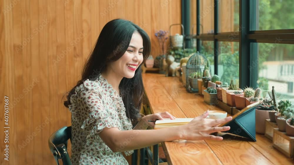 A young beautiful woman is working in coffee shop A young beautiful woman is working in coffee shop