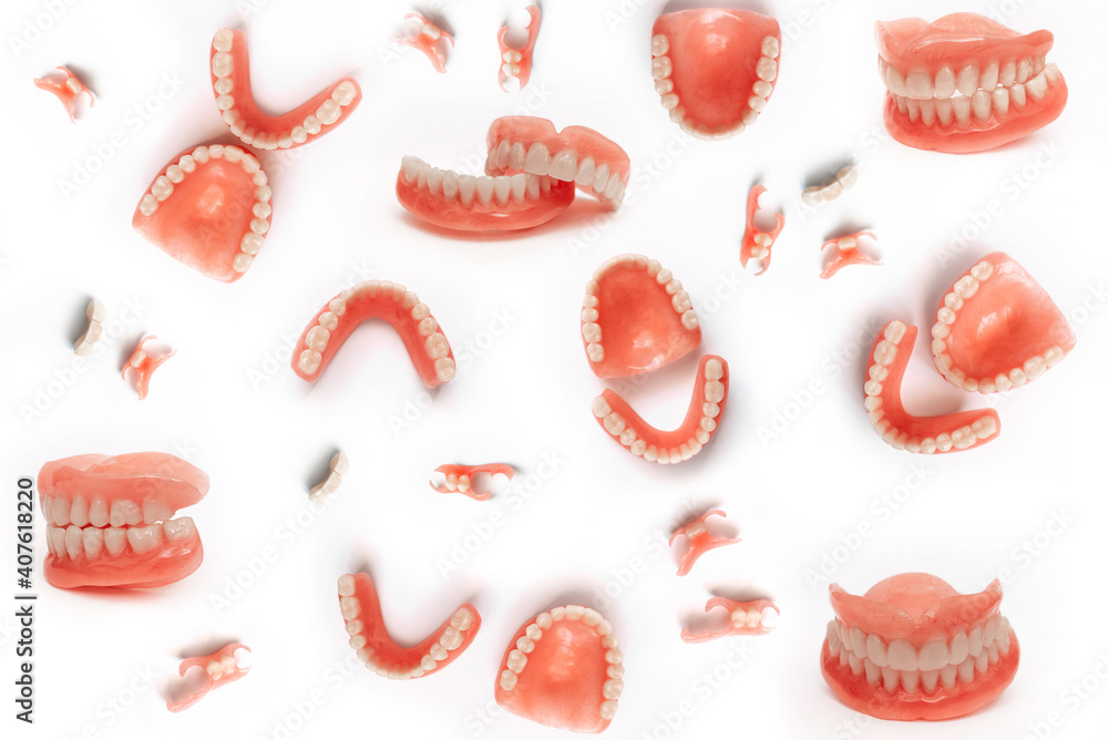 Set of dentures on a white background. Full removable plastic denture
