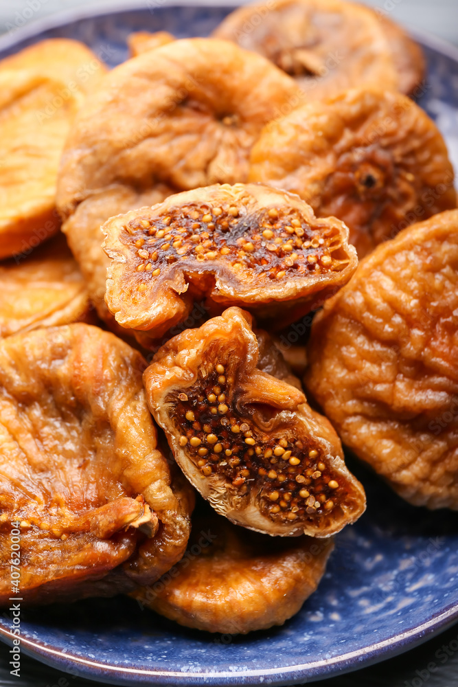 Plate with tasty dried figs, closeup