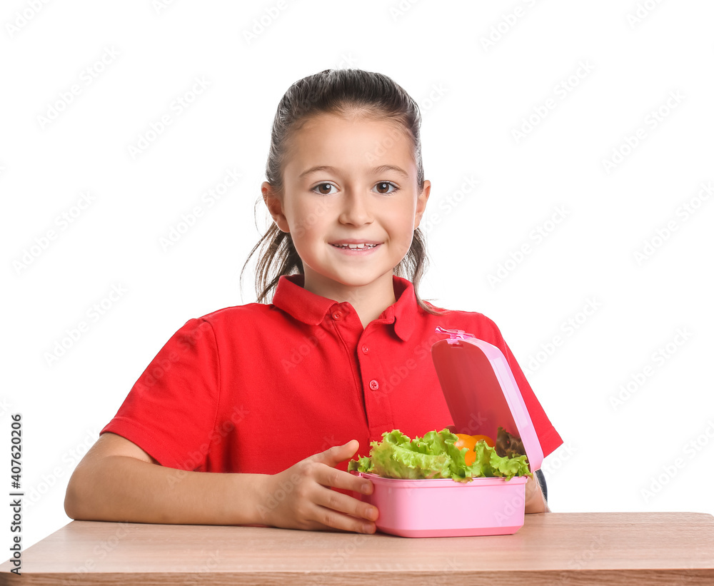Schoolgirl with lunchbox on desk against white background Schoolgirl with lunchbox on desk against white background