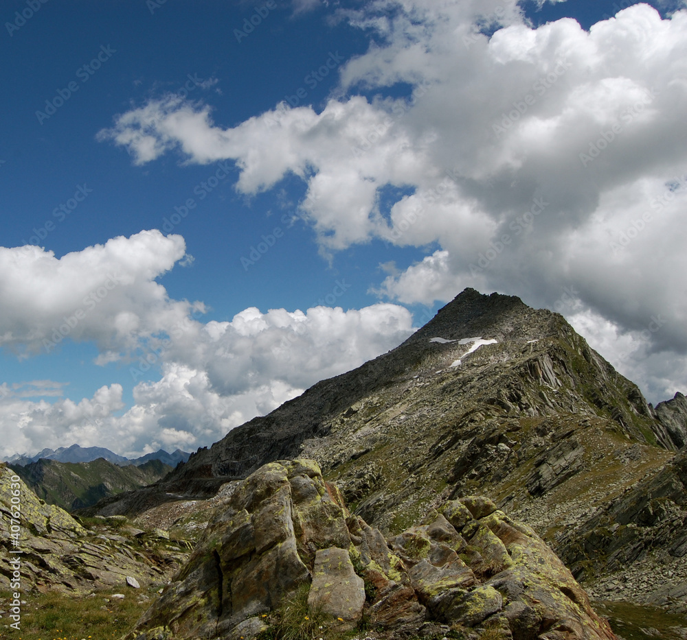 Beautiful shot of rocky mountains under a cloudy sky Beautiful shot of rocky mountains under a cloudy sky