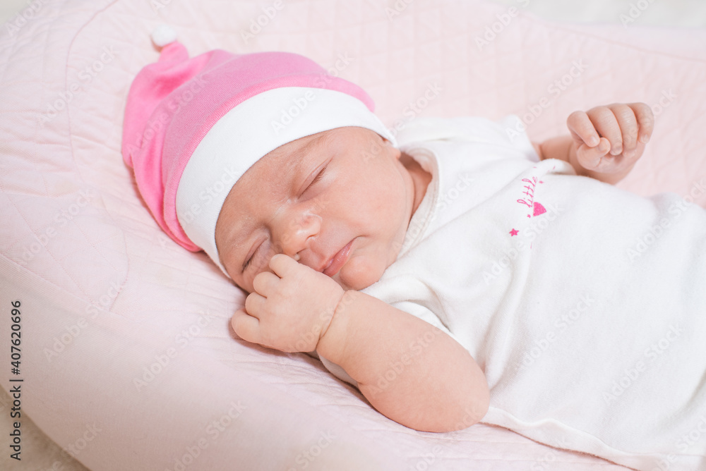 Cute, small and adorable newborn baby girl sleeping Cute, small and adorable newborn baby girl sleeping