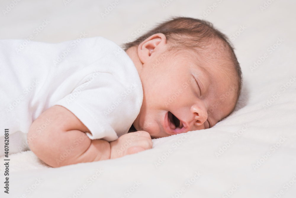 Cute, small and adorable newborn baby girl sleeping Cute, small and adorable newborn baby girl sleeping