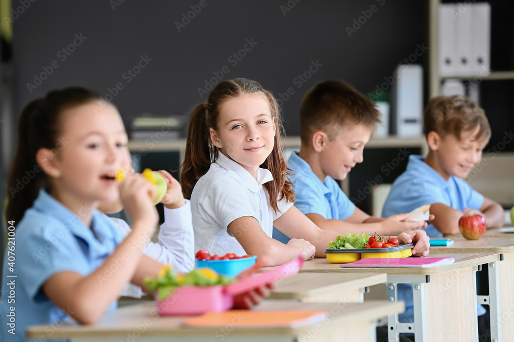 Pupils having healthy lunch in classroom Pupils having healthy lunch in classroom