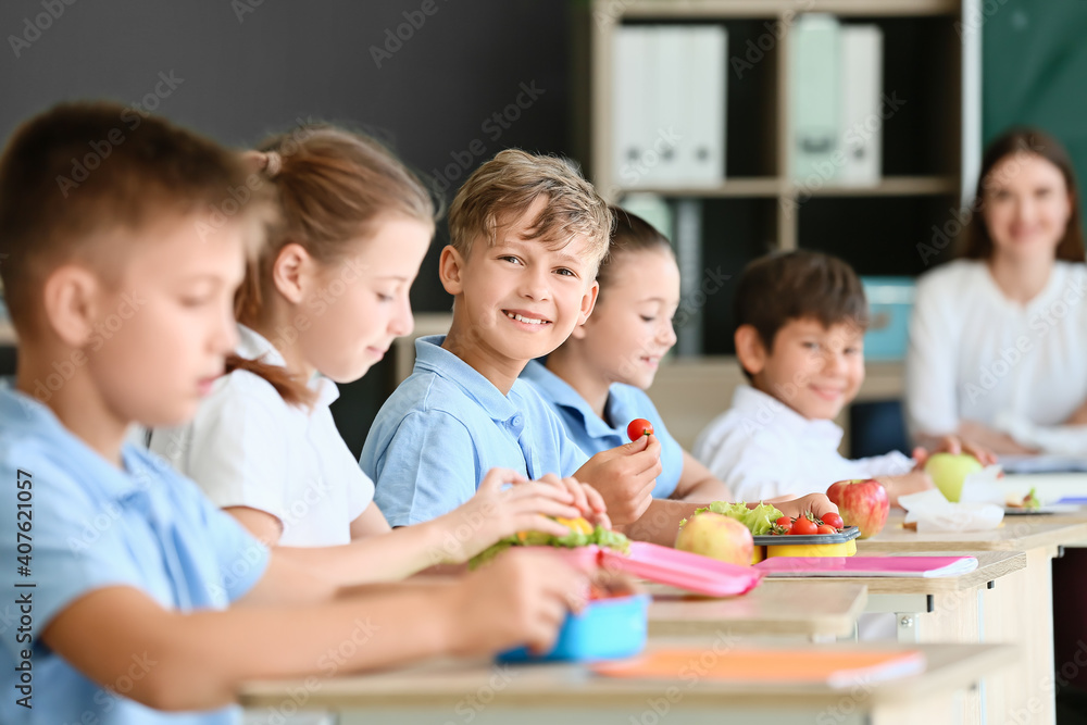 Pupils having healthy lunch in classroom Pupils having healthy lunch in classroom