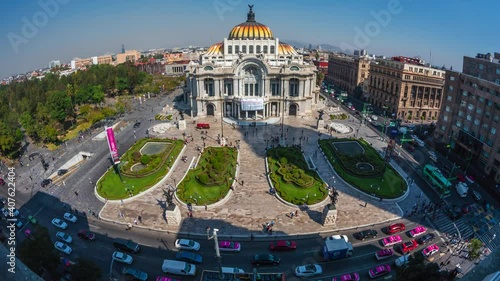 Timelapse view of people and traffic around historical landmark Palace of Fine Arts (Spanish: Palacio de Bellas Artes ) in the Historic Center of Mexico City, Mexico. photo