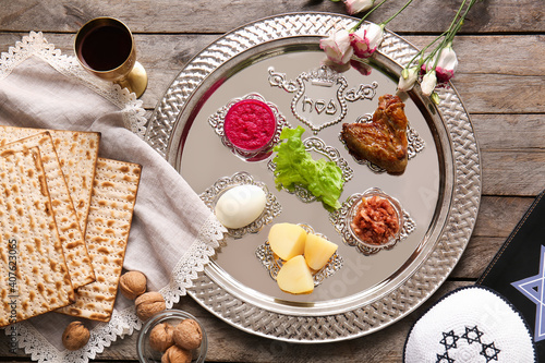 Passover Seder plate with traditional food on table photo