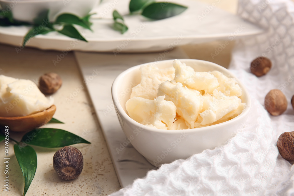 Bowl with shea butter on table Bowl with shea butter on table