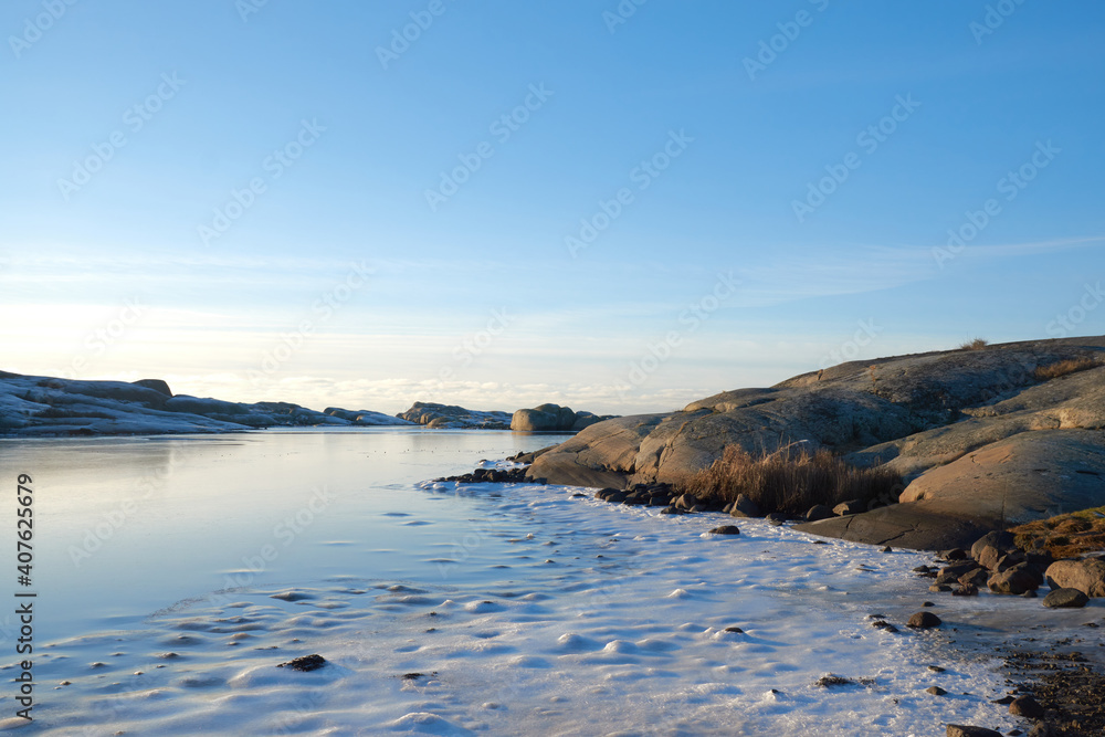 Ice and snow on a frozen lake between scaurs Ice and snow on a frozen lake between scaurs