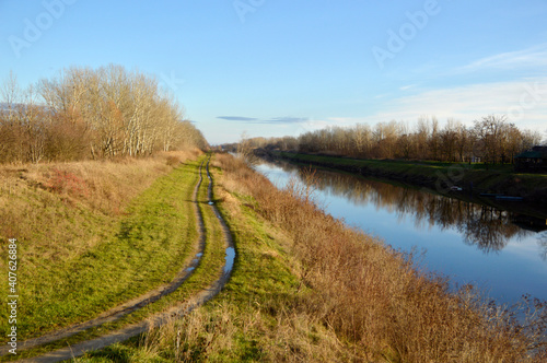 landscape by the river in sunny winter day without snow