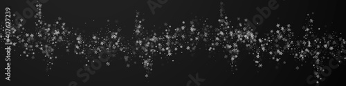 Beautiful snowfall Christmas background. Subtle flying snow flakes and stars on black background. Bold winter silver snowflake overlay template. Wonderful panoramic illustration.