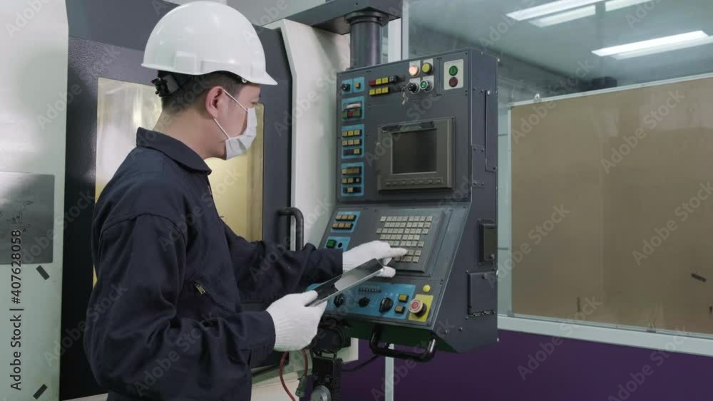 Asian male engineer wearing disposal face mask for protect dust smoke and corona virus while working in workplace or factory. Engineering and industrial concept. Asian male engineer wearing disposal face mask for protect dust smoke and corona virus while working in workplace or factory. Engineering and industrial concept.