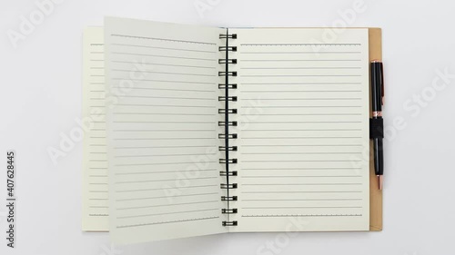 Stop motion animation flip opening empty blank book with text line and black pen in white background
