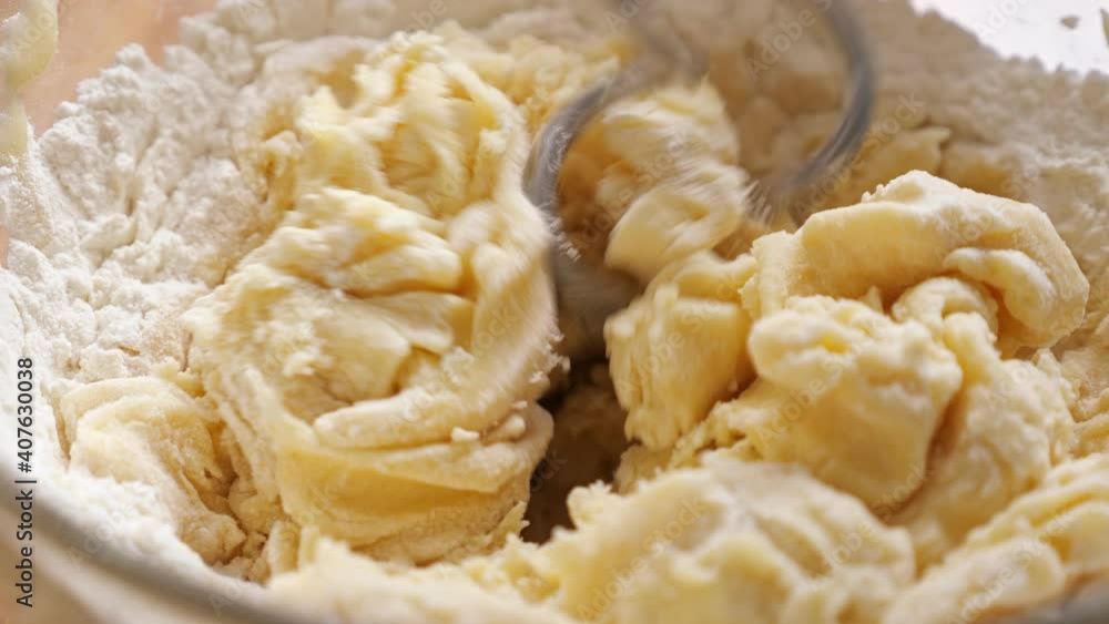 electric mixer kneading dough close-up in slow motion. electric mixer kneading dough close-up in slow motion.
