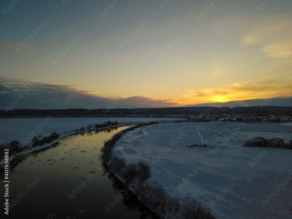 Beautiful winter landscape, sunset over the Dnipro river, view from the drone