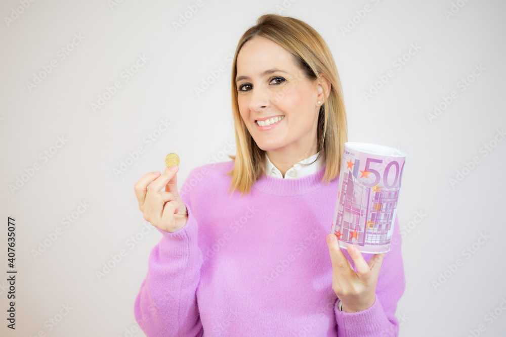 Young caucasian woman holding a piggy bank over white background. Young caucasian woman holding a piggy bank over white background.