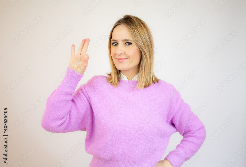 custom made wallpaper toronto digitalBeautiful young woman showing okay sign over white background.